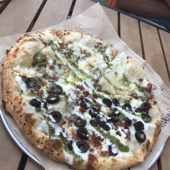 Blaze Pizza - High rise crust with mozzarella, goat cheese, and bacon. Half olives. Then pesto drizzle on the whole pizza and ranch drizzle on half - Salad Near Me - Laurel, Maryland Blaze Pizza - High rise crust with mozzarella, goat cheese, and bacon. Half olives. Then pesto drizzle on the whole pizza and ranch drizzle on half - Salad Near Me - Laurel, Maryland