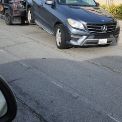 All Brauns Towing - Mercedes truck being towed from Sycamore Bay apt
