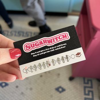 Sugarwitch - a person holding a business card - Desserts Near Me - St. Louis, Missouri