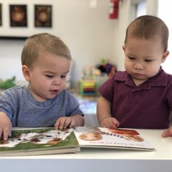 BunnyBears Infant Toddler Center - "Book reading" starts way before alphabet. Infant room