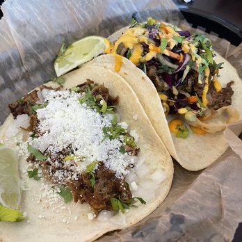 Torchy's Tacos - Green Chile pork (left) Tokyo drift taco of the month (right) - Tex-Mex Near Me - Raleigh, North Carolina Torchy's Tacos - Green Chile pork (left) Tokyo drift taco of the month (right) - Tex-Mex Near Me - Raleigh, North Carolina