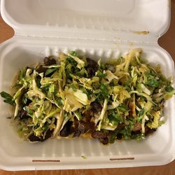 There are four tacos here ...two short rib two spicy pork