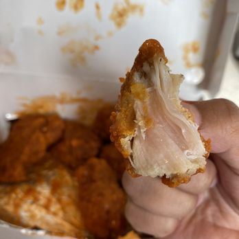 Checkers - a hand holding a half eaten chicken sandwich - Fast Food Near Me - Gainesville, Georgia Checkers - a hand holding a half eaten chicken sandwich - Fast Food Near Me - Gainesville, Georgia