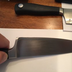 Photo of Mike & Son Sharpening Service - Brooklyn, NY, US. With a Wusthof Chef's knife, dark spots on edge closer to handle is where blade has been folded over from one side to the other.