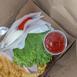 Tomatoes and onions thrown in a separate bag since staff didn't want to assemble the food. Tomatoes and onions thrown in a separate bag since staff didn't want to assemble the food.