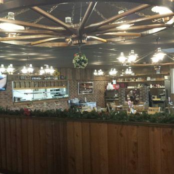 K-Bob's Steakhouse - Wagon wheel chandelier & other western oriented paraphernalia. - Steakhouses Near Me - Raton, New Mexico