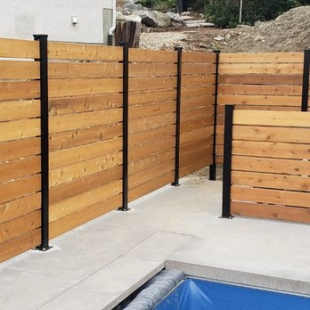 Premier Fencing Installations - Cedar Slip Fence with Black Aluminum posts - Fences & Gates Near Me Premier Fencing Installations - Cedar Slip Fence with Black Aluminum posts - Fences & Gates Near Me