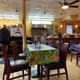 a dining room with tables and chairs a dining room with tables and chairs