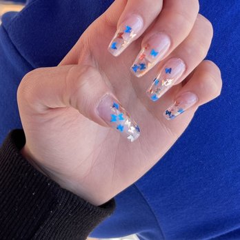 Divine Nails And Lashes - Cut on ring finger from machine, damaged cuticles, rough edges, can see glue, butterfly placement not thought out. - Nail Salons Near Me - Irvine, California Divine Nails And Lashes - Cut on ring finger from machine, damaged cuticles, rough edges, can see glue, butterfly placement not thought out. - Nail Salons Near Me - Irvine, California