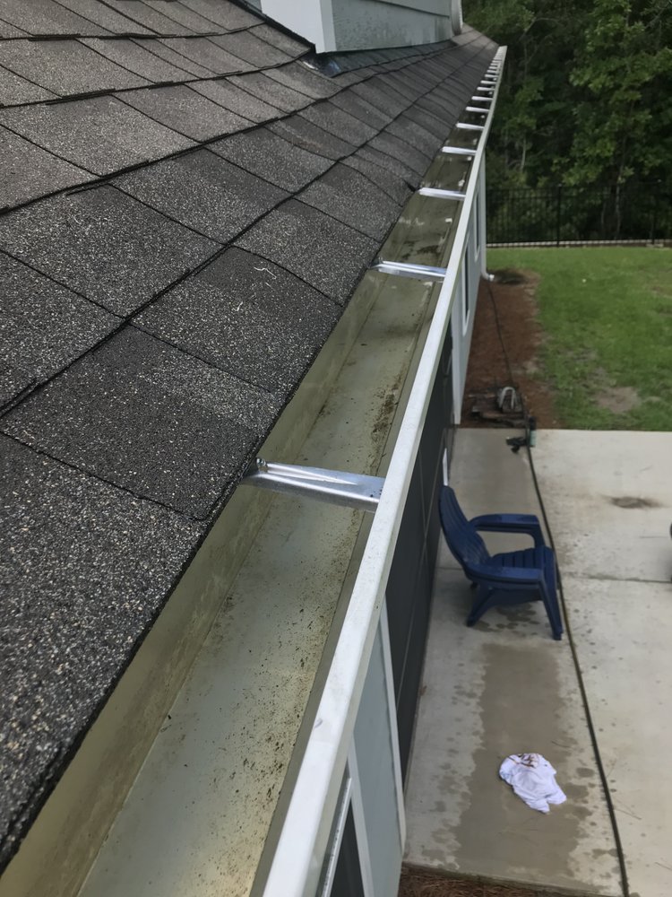 Slide of Gutter Clutter Cleaning & Roof Repair