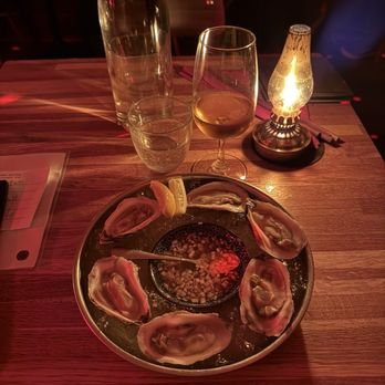In Between Days - New Brunswick oysters and and a glass of sake "tamagans time machine 1712" . Both excellent! - Cocktail Bars Near Me - St. Petersburg, Florida