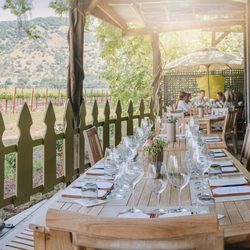 PlumpJack Estate Winery - Tasting patio with vineyard view