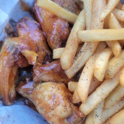 The Bodega 856 - Wings with Bodega Sauce, and fries
