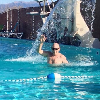 Sand Dunes Swimming Pool - The BIL enjoying the therapeutic high pressure waterfall in the pool - Swimming Pools Near Me - Hooper, Colorado