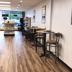 Crown's Pharmacy and Clinic - There are multiple seating areas accompanied by a TV for the customer's comfort.