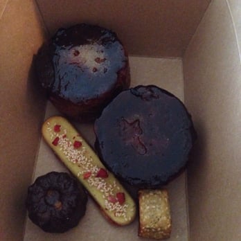 Cellar Door Provisions - Burnt kouing amans, cats tongue cookie, fig Newton and canele. - New American Near Me - Chicago, Illinois