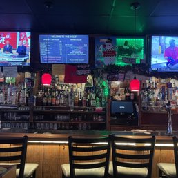 a bar with multiple televisions a bar with multiple televisions