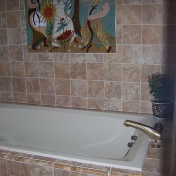 BIPP Construction - a bathtub in a tiled bathroom - General Contractors Near Me - San Mateo, California BIPP Construction - a bathtub in a tiled bathroom - General Contractors Near Me - San Mateo, California