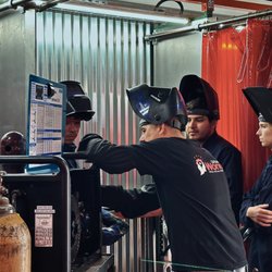 Urban Workshop - Welding students and instructor going over setting up the equipment on their first session