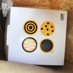 a box with a smiley face sticker on it a box with a smiley face sticker on it