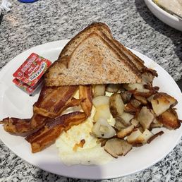 Eggs, toast, American fries, and bacon