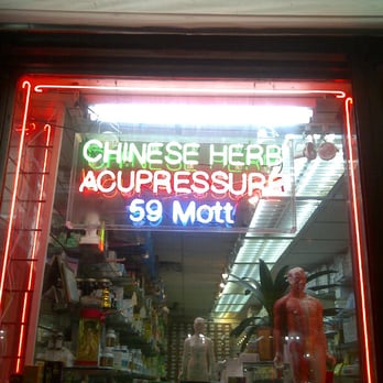 Health Town - a neon sign in a store window - Herbs & Spices Near Me - New York, New York Health Town - a neon sign in a store window - Herbs & Spices Near Me - New York, New York