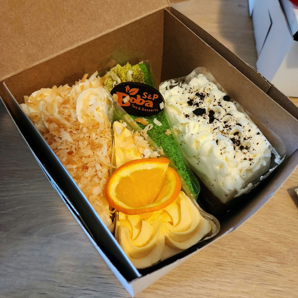 Four slices of different cakes Four slices of different cakes