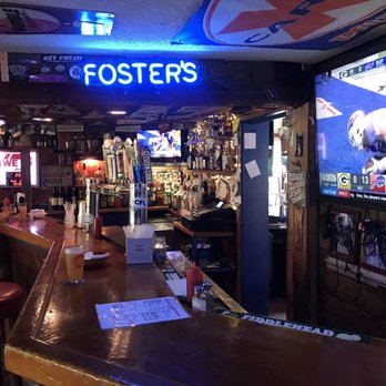 The Loft Tavern - a man sitting at the bar watching a baseball game - Bars Near Me - Ludlow, Vermont