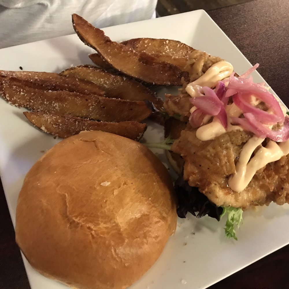 Elliotts an Urban Kitchen - Fried chicken sandwich and potato wedges - New American Near Me - Spokane, Washington Elliotts an Urban Kitchen - Fried chicken sandwich and potato wedges - New American Near Me - Spokane, Washington