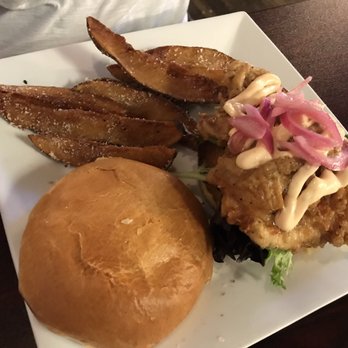 Elliotts an Urban Kitchen - Fried chicken sandwich and potato wedges - New American Near Me - Spokane, Washington Elliotts an Urban Kitchen - Fried chicken sandwich and potato wedges - New American Near Me - Spokane, Washington