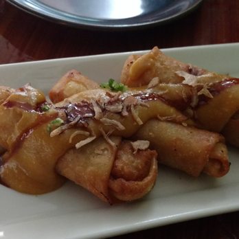 Bali Café - Lumpia ($6.99). Chicken, cabbage, and carrot wrapped in a shell w/peanut sauce on top. - Sushi Bars Near Me - Miami, Florida Bali Café - Lumpia ($6.99). Chicken, cabbage, and carrot wrapped in a shell w/peanut sauce on top. - Sushi Bars Near Me - Miami, Florida