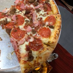 Lauro's Italian Restaurant & Pizzeria - What is left of my Meat Lovers Large!