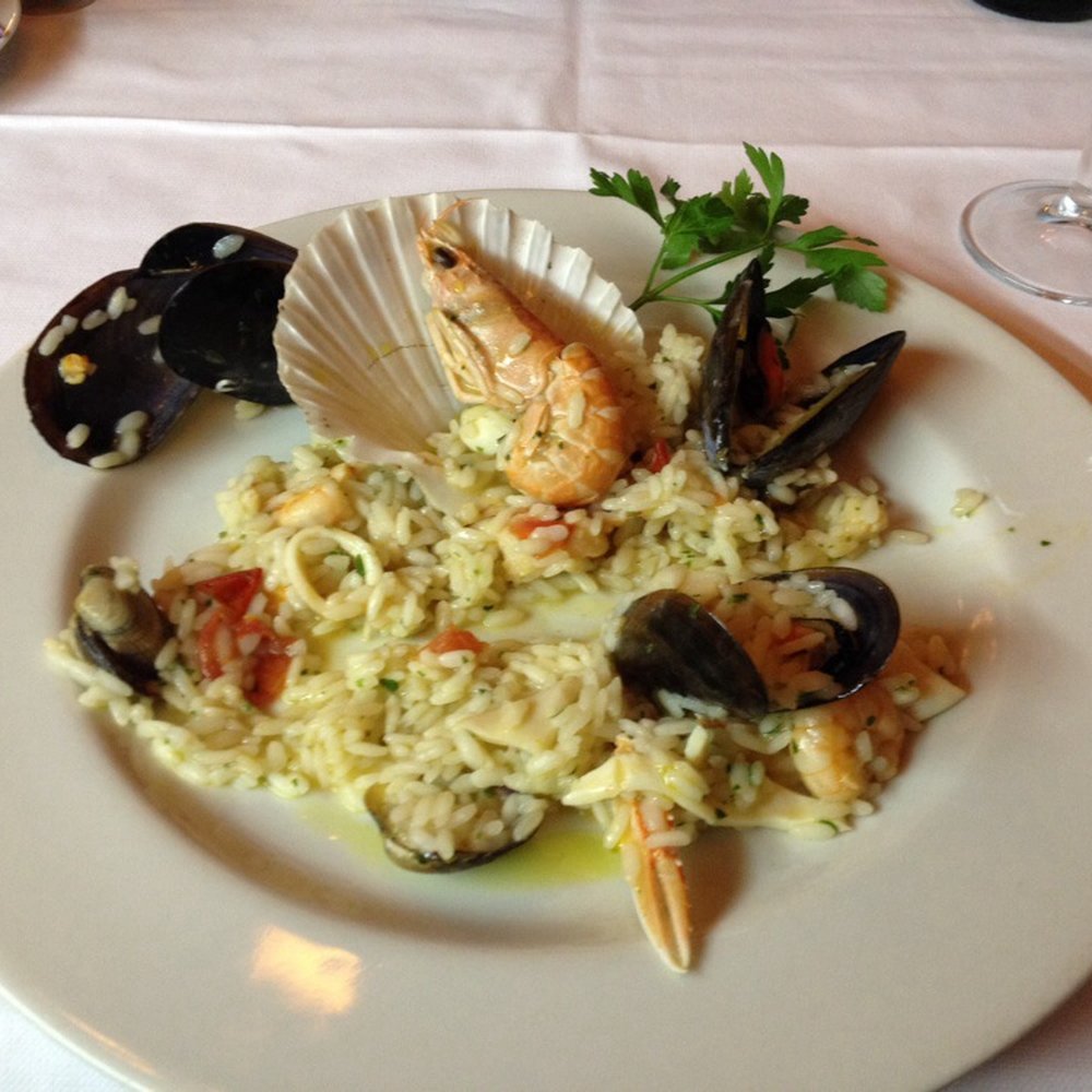 Seafood risotto. Is delicious. I come 2 Milan 2x per year and this is a must to stop. Best pizza in Italy.