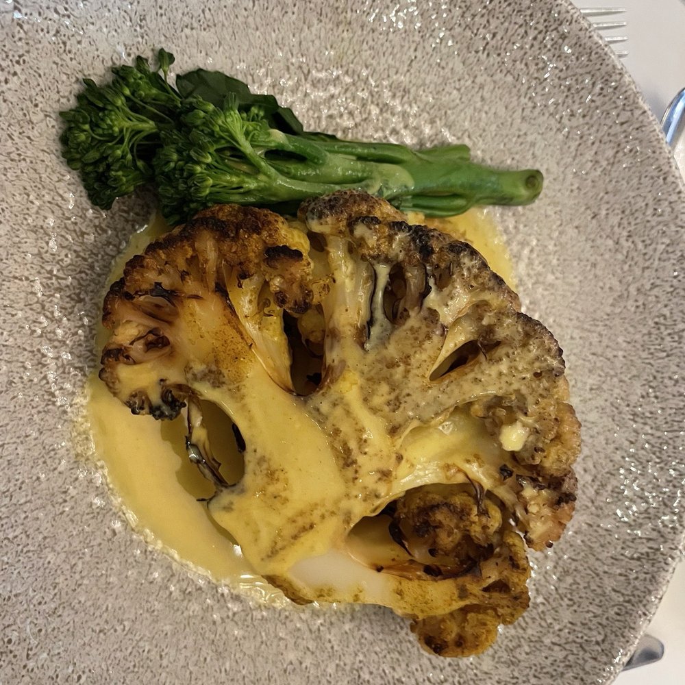 Crieff Hydro Hotel - Vegetarian option. Cauliflower steak with onion hummus and broccoli. - Hotels Near Me