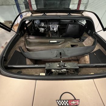 Corvette Mike Midwest - Parts scattered in my hatch area Door panel twisted lying in truck, notice the back panel where there is a hole for the latch - Auto Repair Near Me - Burr Ridge, Illinois