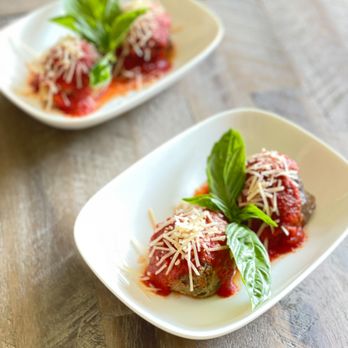 Fireova Pizza - two plates of meatballs with sauce and basil - Caterers Near Me