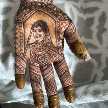 Just Wow by Dhwani - Closeup of bride figurines in henna - Henna Artists Near Me