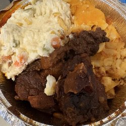 Tasty Caribbean Buffet - Small oxtail meal with potato salad and macaroni and cheese
