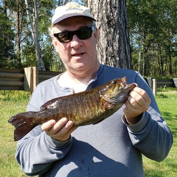 Michi-Aho Resort - I caught an 18 inch smallmouth from the bridge (one of the best locations on the river to catch fish). - Resorts Near Me - Crystal Falls, Michigan Michi-Aho Resort - I caught an 18 inch smallmouth from the bridge (one of the best locations on the river to catch fish). - Resorts Near Me - Crystal Falls, Michigan
