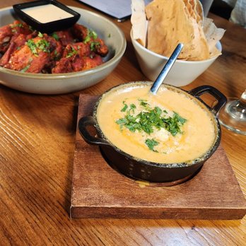 Oh' Calcutta - Baingan bharta cheese dip with chips and Tandoori chicken wing - Indian Near Me - Winston-Salem, North Carolina Oh' Calcutta - Baingan bharta cheese dip with chips and Tandoori chicken wing - Indian Near Me - Winston-Salem, North Carolina