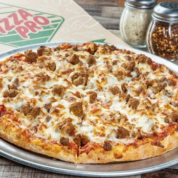 Pizza Pro Lake Palestine - a pizza on a pizza pan - Pizza Near Me - Chandler, Texas Pizza Pro Lake Palestine - a pizza on a pizza pan - Pizza Near Me - Chandler, Texas