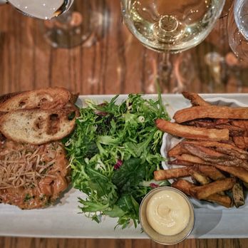 Les Cavistes - a plate of food and a glass of wine - French Near Me - Montreal, Quebec Les Cavistes - a plate of food and a glass of wine - French Near Me - Montreal, Quebec