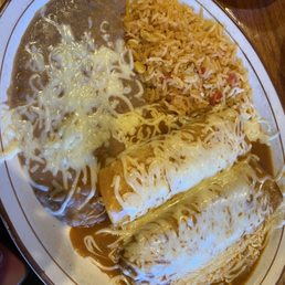Chicken enchilada, pork tamale with rice and beans. Rice was very good.