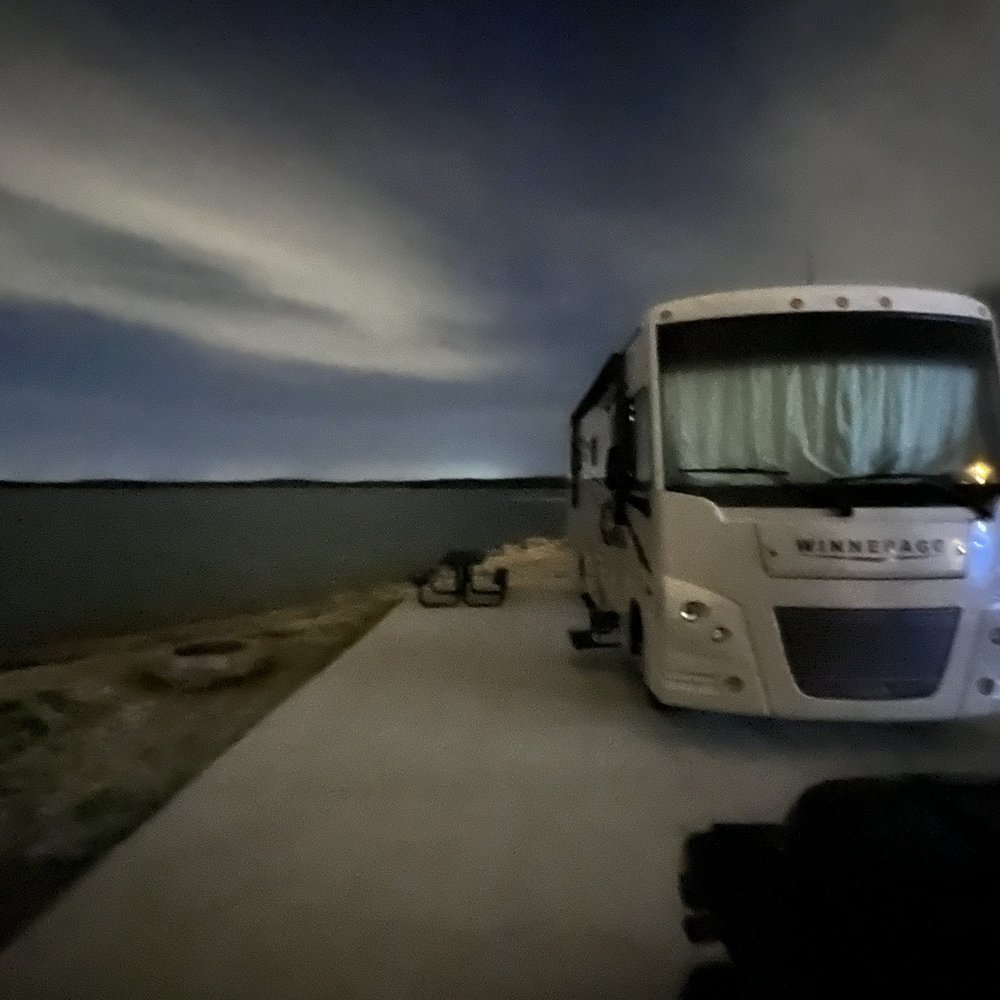 a motorhome parked on the side of the road a motorhome parked on the side of the road