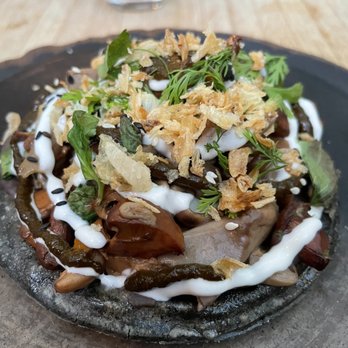 Claro - Loaded mushroom tostada with goat cheese atop A THICC blue corn tortilla - Mexican Near Me - Brooklyn, New York