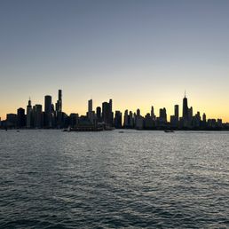 a view of the chicago skyline at sunset