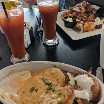 Cafe Melissa - Chorizo biscuits and gravy and a bloody mary chicken and waffles on the other plate - American Near Me - Avon Lake, Ohio Cafe Melissa - Chorizo biscuits and gravy and a bloody mary chicken and waffles on the other plate - American Near Me - Avon Lake, Ohio