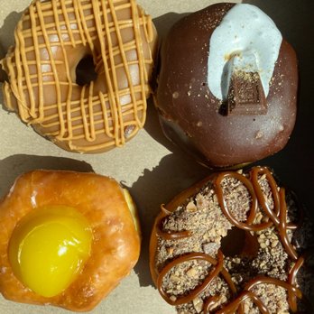 Go Nutz Donuts - Top left to bottom right: peanut butter pancake, s'mores, lemon cream, health bar. - Donuts Near Me - Wildomar, California Go Nutz Donuts - Top left to bottom right: peanut butter pancake, s'mores, lemon cream, health bar. - Donuts Near Me - Wildomar, California