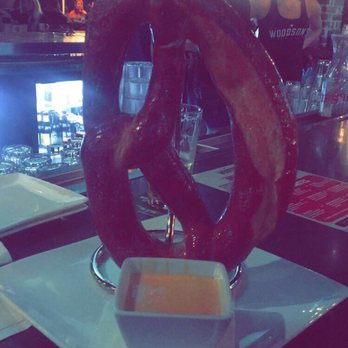 Woodson's Local Tap + Kitchen - Giant Pretzel served with a delicious cheese sauce. The perfect amount of crisp, salty goodness- definitely meant to be shared - Comfort Food Near Me - Conroe, Texas