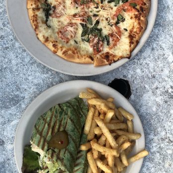 Empire Cafe - our spread: Margarita Pizza and Empire Chicken Salad Wrap - Breakfast & Brunch Near Me - Houston, Texas Empire Cafe - our spread: Margarita Pizza and Empire Chicken Salad Wrap - Breakfast & Brunch Near Me - Houston, Texas